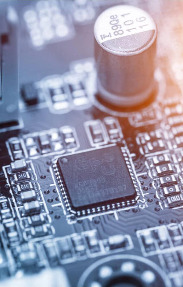 Close-up of an integrated circuit used for ASIC design and verification, highlighting intricate electronic components.